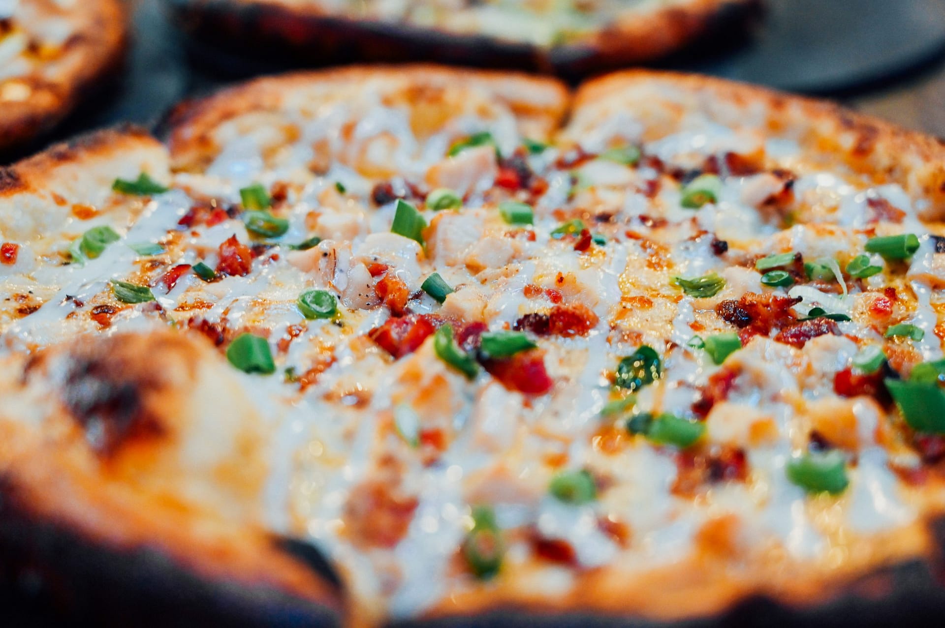 A close-up photograph of craft pizza at Crafty Squirrel in Downtown, St. Petersburg